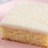 A slice of vanilla Texas sheet cake with brown butter icing.