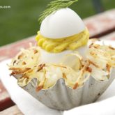 Deviled eggs in a hashbrown nest, a cute Easter appetizer.