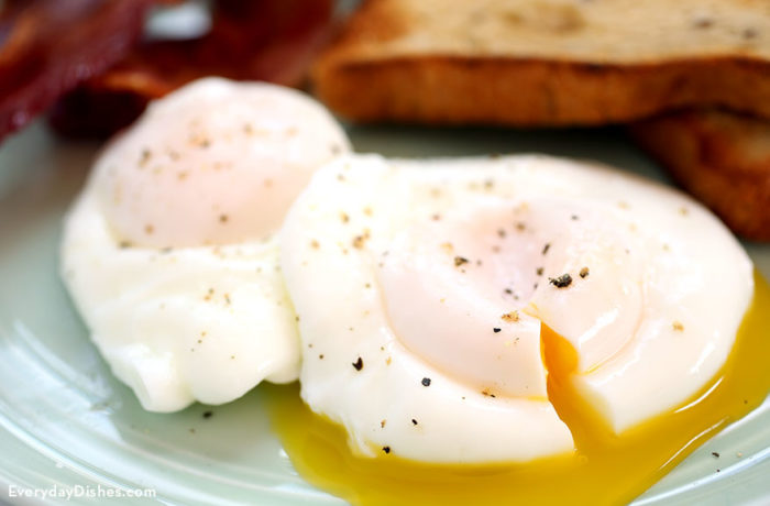 Two perfectly made poached eggs.