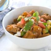 A bowl of delicious Cuban chicken stew that was made in a slow cooker.