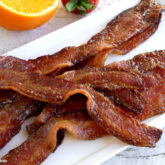 A plate of bacon that was made easily in the oven.