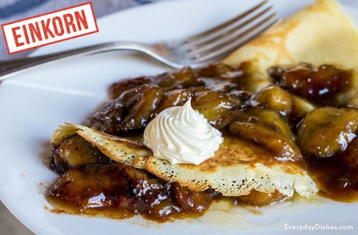 A plate of delicious einkorn bananas Foster crepes, ready to enjoy.