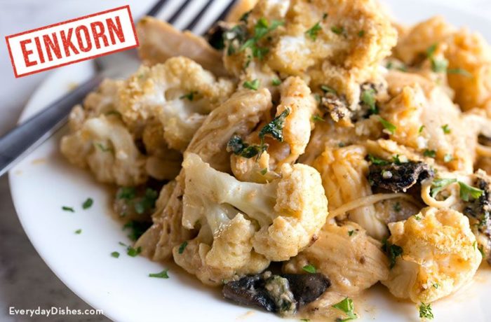 A plate of einkorn asiago chicken with spinach cauliflower — a tasty dinner.