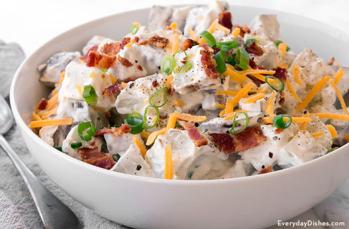 A bowl of loaded baked potato salad — a great side dish.