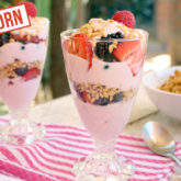 Two delicious berry yogurt parfait with einkorn wheat granola.