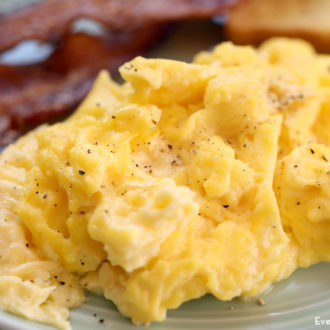 A plate of fluffy scrambled eggs, ready to enjoy.