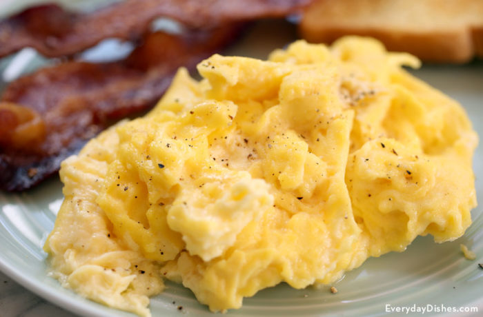 A plate of fluffy scrambled eggs, ready to enjoy.