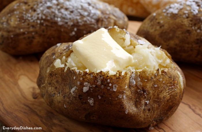 A perfectly baked potato with butter.