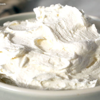 A bowl of freshly made vanilla buttercream frosting.