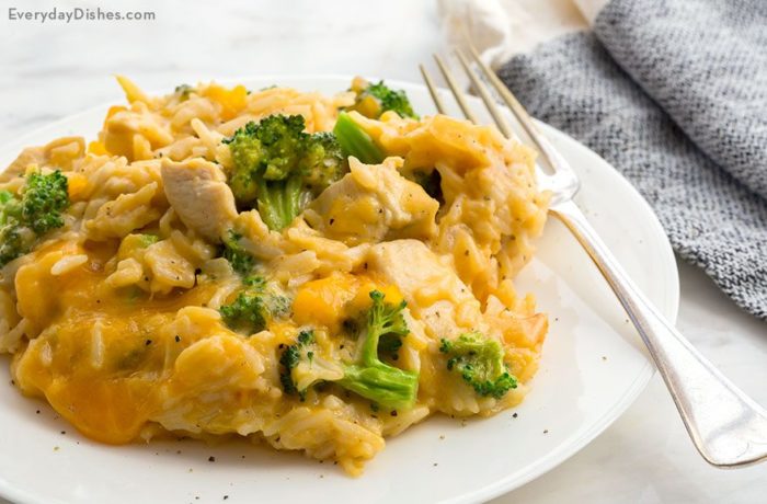 A plate of cheesy chicken and rice, on the table and ready for dinner.