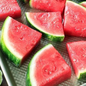 A pan of coconut rum infused watermelon wedges, a refreshing treat
