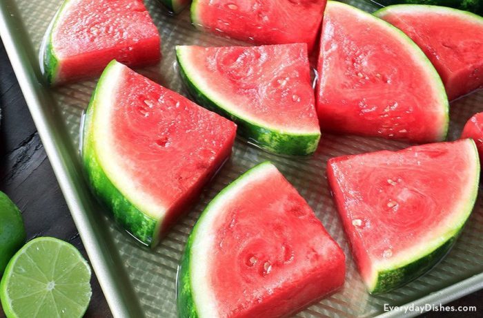 A pan of coconut rum infused watermelon wedges, a refreshing treat