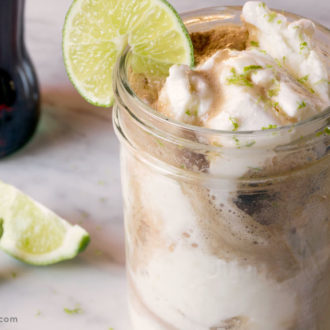 A dirty Coke float in a mason jar, ready to enjoy