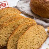 A freshly made loaf of einkorn whole wheat bread, sliced and ready to enjoy.