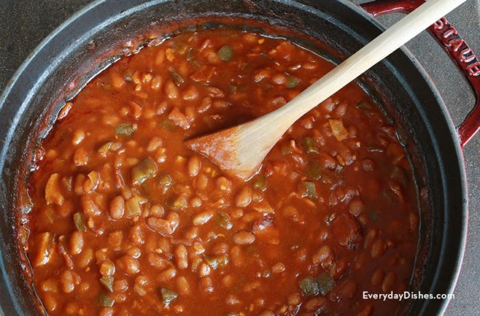 A pot of rich and tangy homemade BBQ baked beans with bacon.