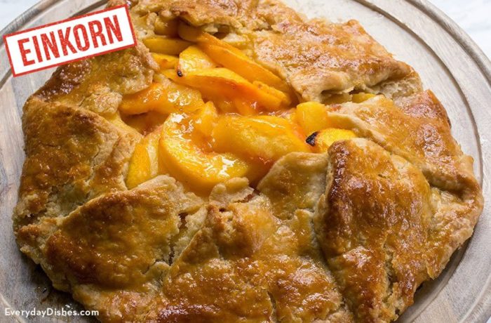 A homemade rustic peach tart made with einkorn.