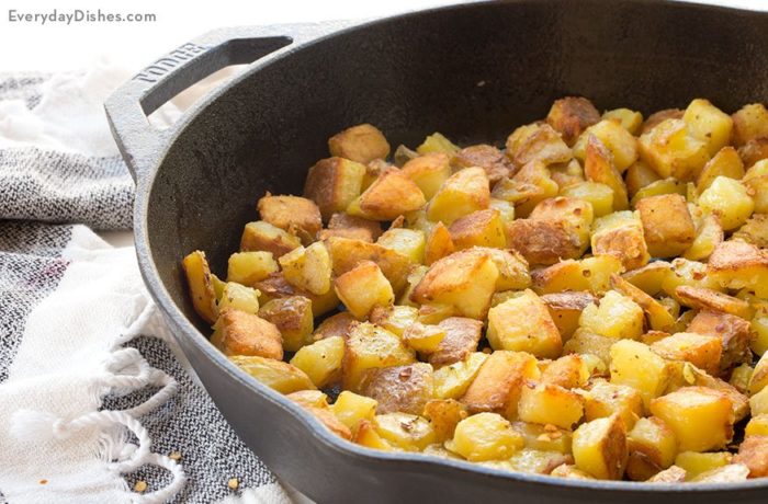 A skillet of crispy oven-roasted potatoes, the perfect side dish.