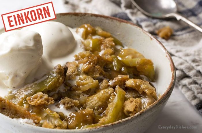 A serving of einkorn caramel apple crumble with a scoop of ice cream.