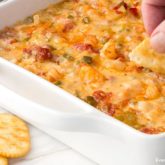 A dish of spicy shrimp dip, served with crackers