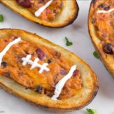 Homemade potato skins that are decorated to look like footballs — a great game day snack!