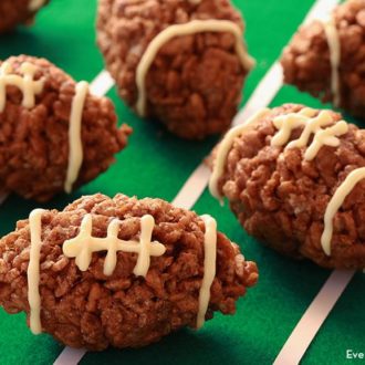 Chocolate and peanut butter Rice Krispies footballs — a unique dessert for a Super Bowl party.
