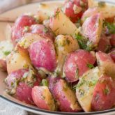 A delicious dairy-free potato salad, served on a plate and ready to enjoy.