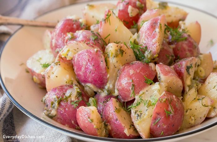 A delicious dairy-free potato salad, served on a plate and ready to enjoy.