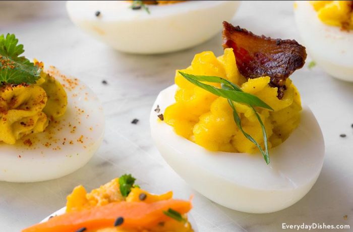 A delicious bacon deviled egg, ready to eat.