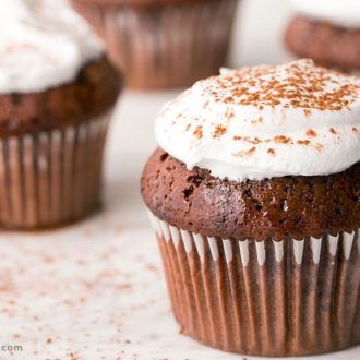A batch of chocolate einkorn cupcakes with marshmallow frosting.