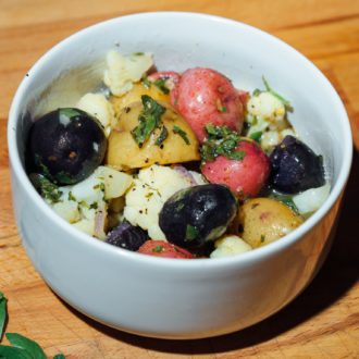 A bowl of no mayo potato salad, freshly made in an instant pot.