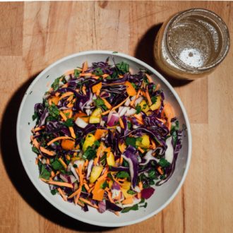 A bowl of no mayo coleslaw, fresh and ready to serve as a side dish.