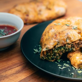 A plate with some homemade easy and delicious calzones.