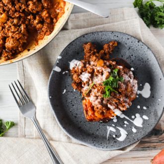 A plate of delicious Whole30 sloppy Joe stuffed sweet potatoes on the table for dinner.