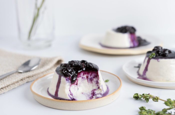 The vegan dessert coconut milk panna cotta with blueberries and thyme, ready to enjoy