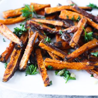 A plate of delicious sweet potato fries made in an air fryer.