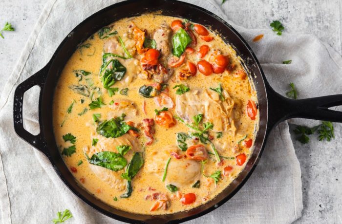 A pot of creamy Tuscan chicken, a keto recipe.