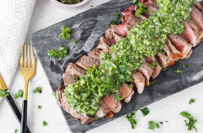 grilled steak with chimichurri, ready to enjoy