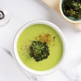 A bowl of delicious vegan potato kale soup, ready to eat for dinner