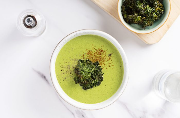A bowl of delicious vegan potato kale soup, ready to eat for dinner