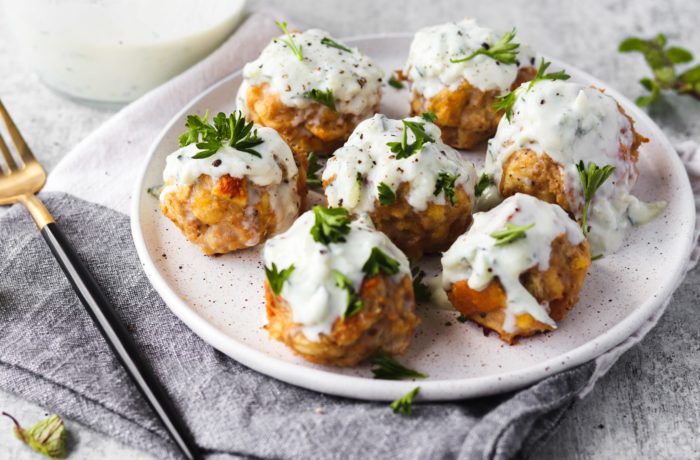 A plate of delicious high protein turkey meatballs with tzatziki, ready to enjoy for dinner