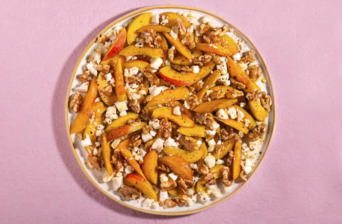 A bowl of easy fruit and nut salad, ready to serve.