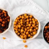 Three containers of crunchy chickpeas — a high protein snack for weight loss.