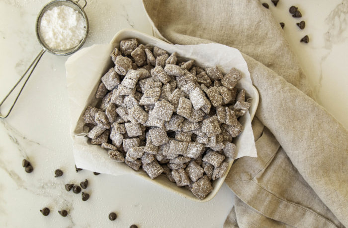 A dish of homemade puppy chow, a high-protein dessert for dog lovers.